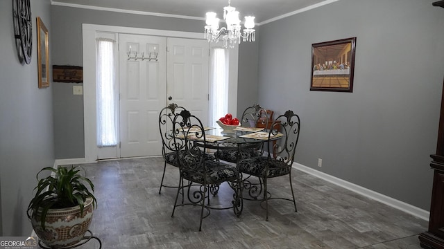 dining area featuring dark hardwood / wood-style floors, ornamental molding, and an inviting chandelier