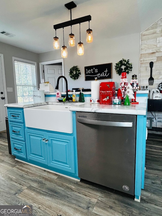 kitchen with pendant lighting, dishwasher, blue cabinetry, sink, and dark hardwood / wood-style floors