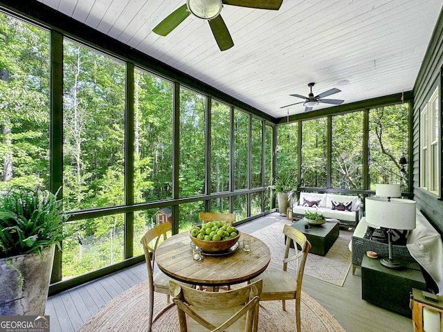 sunroom featuring ceiling fan and a healthy amount of sunlight