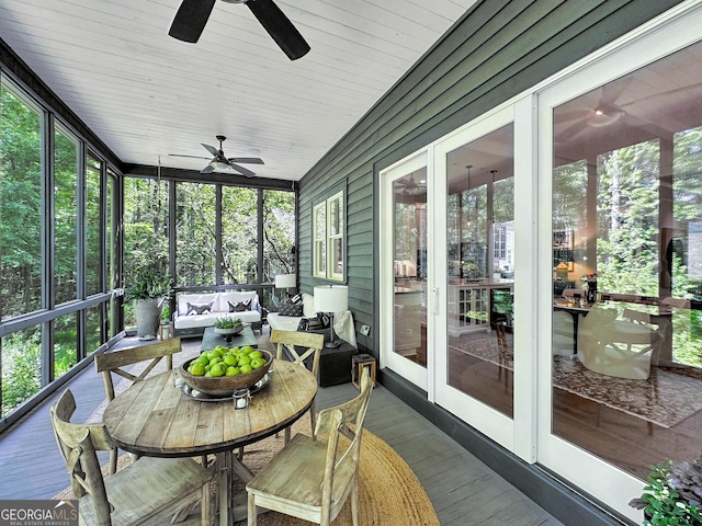 sunroom with ceiling fan and a wealth of natural light