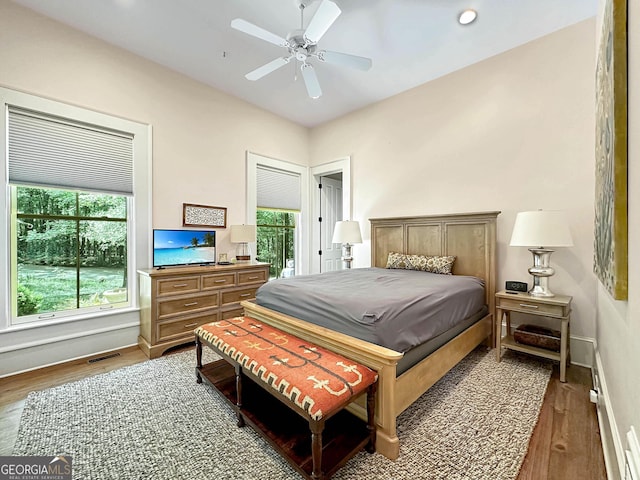 bedroom featuring ceiling fan and hardwood / wood-style flooring