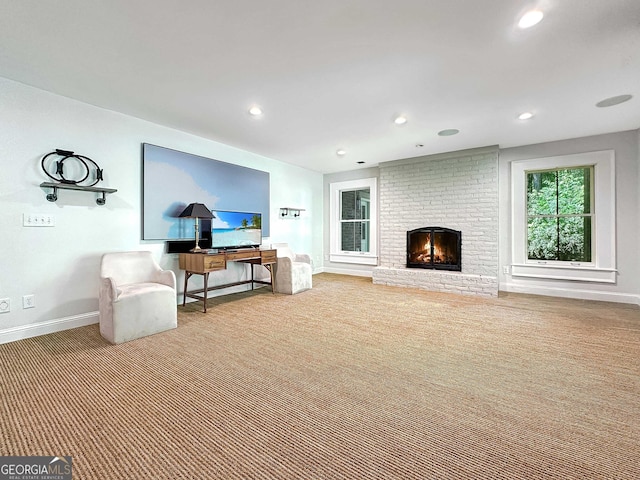 carpeted living room with a fireplace