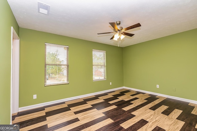 unfurnished room featuring ceiling fan, a textured ceiling, and hardwood / wood-style floors