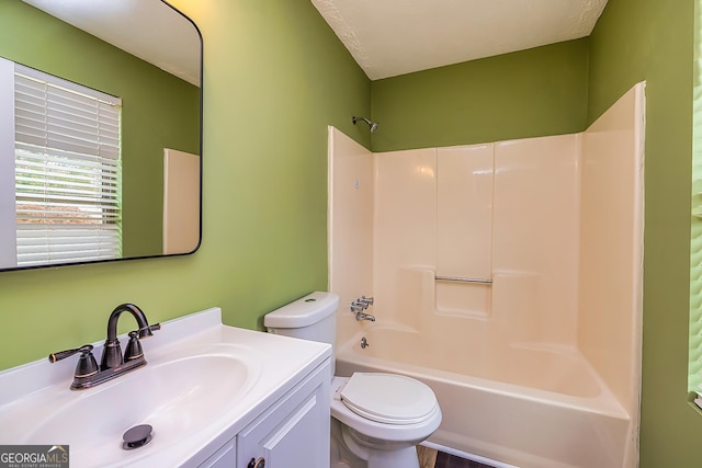 full bathroom with washtub / shower combination, toilet, and vanity