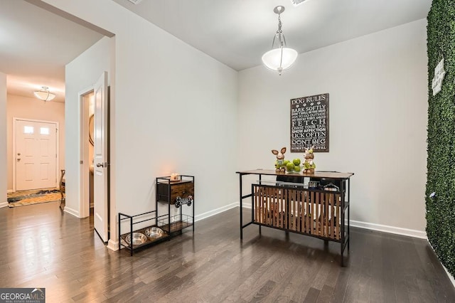 dining area with dark hardwood / wood-style flooring