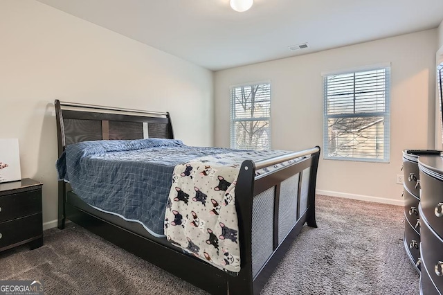 bedroom featuring dark colored carpet