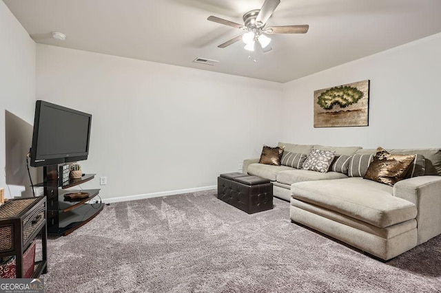 living room featuring carpet and ceiling fan