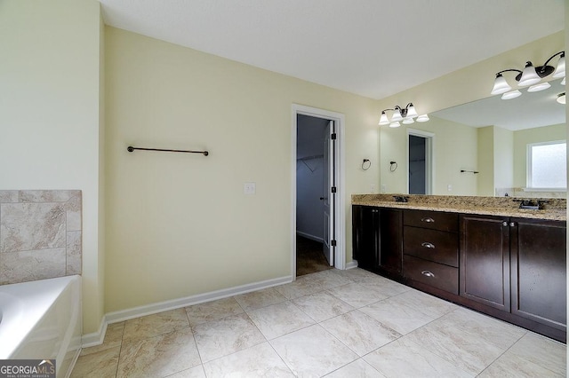 bathroom with vanity and a bathtub