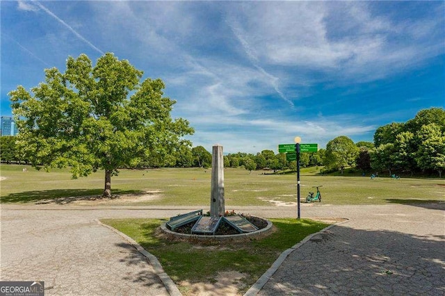 view of home's community featuring a lawn