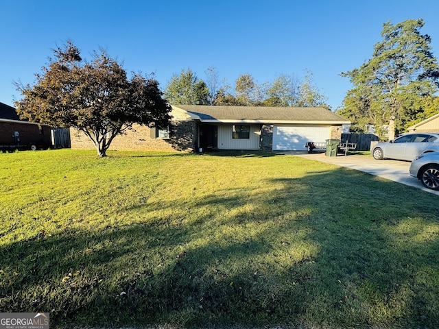 view of front of property featuring a front yard and a garage