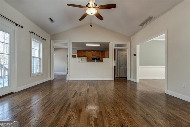 unfurnished living room with vaulted ceiling, ceiling fan, and dark hardwood / wood-style floors