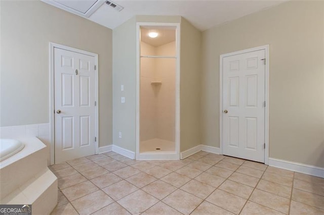 bathroom featuring tile patterned flooring and a shower