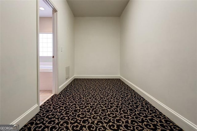 empty room featuring light carpet