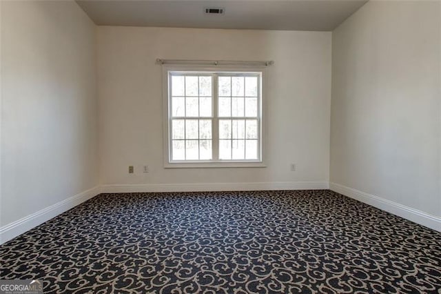 unfurnished room featuring carpet flooring