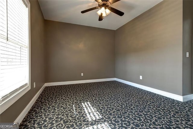 spare room with ceiling fan