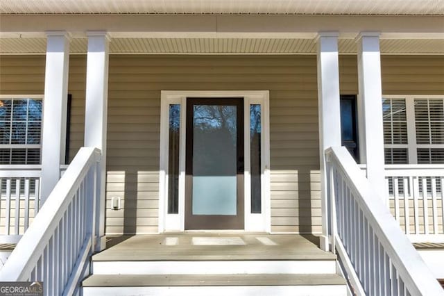 doorway to property with covered porch