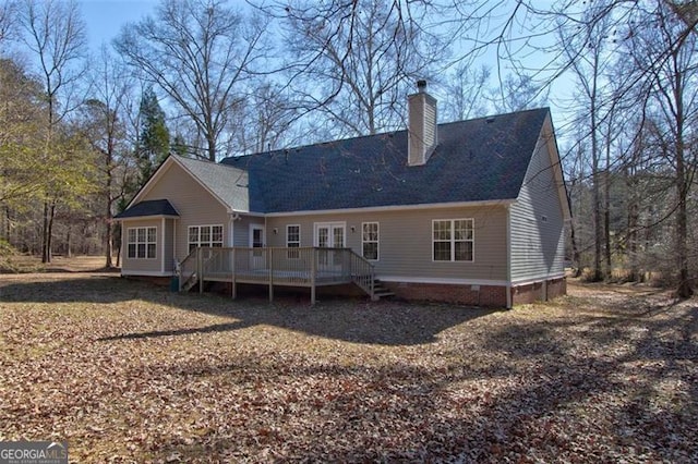 rear view of house featuring a wooden deck