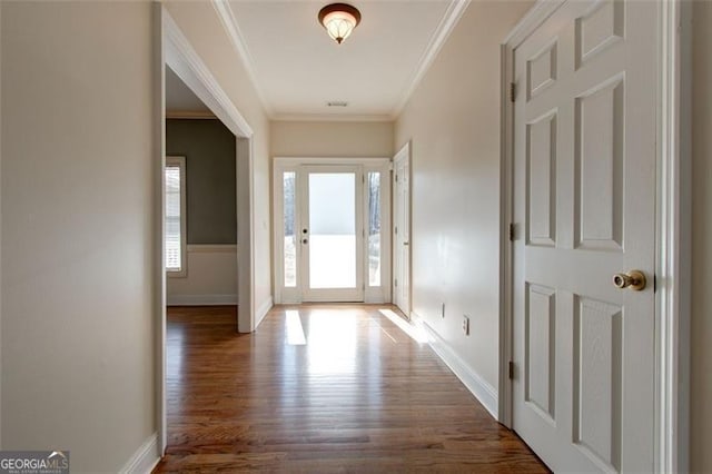 interior space with dark wood-type flooring and ornamental molding