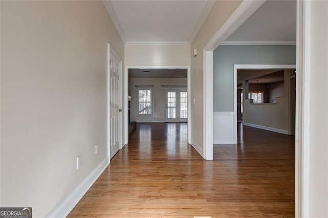 hall with crown molding and hardwood / wood-style floors