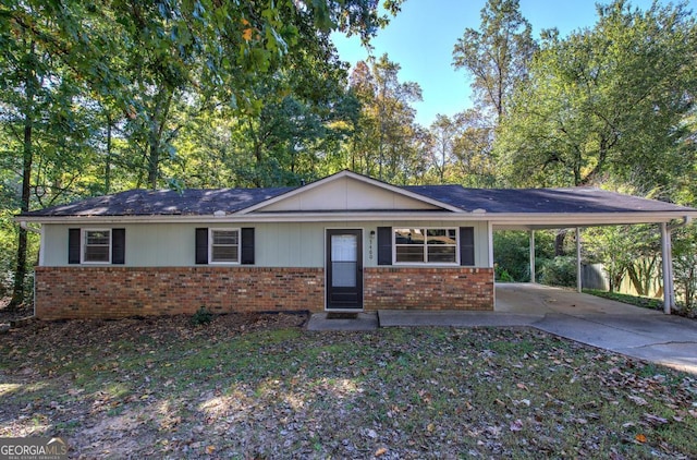 ranch-style house featuring a carport