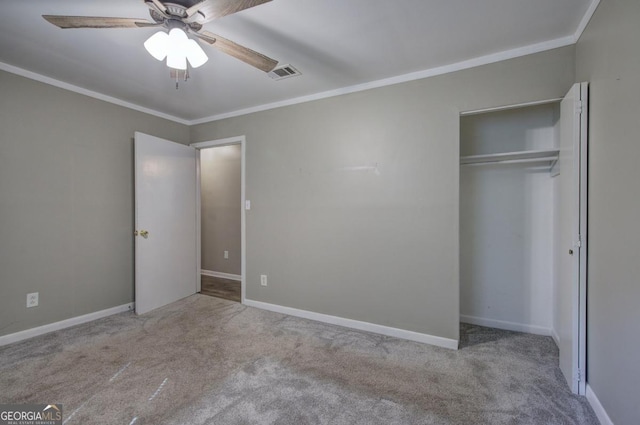 unfurnished bedroom featuring ceiling fan, a closet, light carpet, and ornamental molding