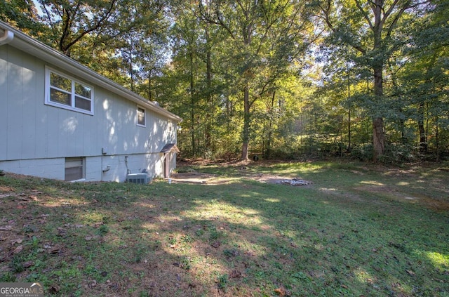 view of yard with central AC