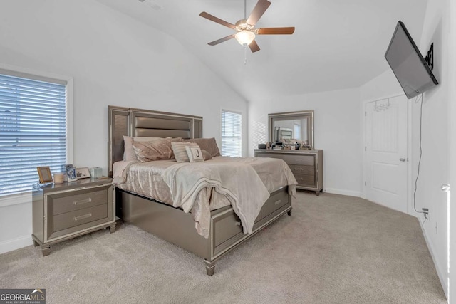 bedroom featuring ceiling fan, light colored carpet, and lofted ceiling