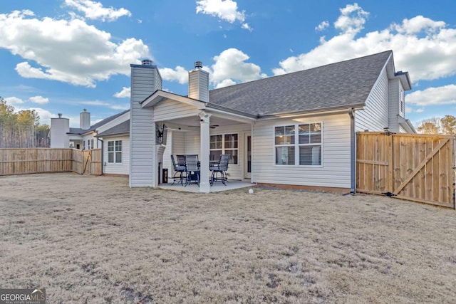 rear view of house featuring a patio