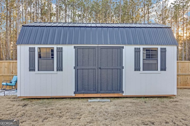 view of outbuilding with a lawn