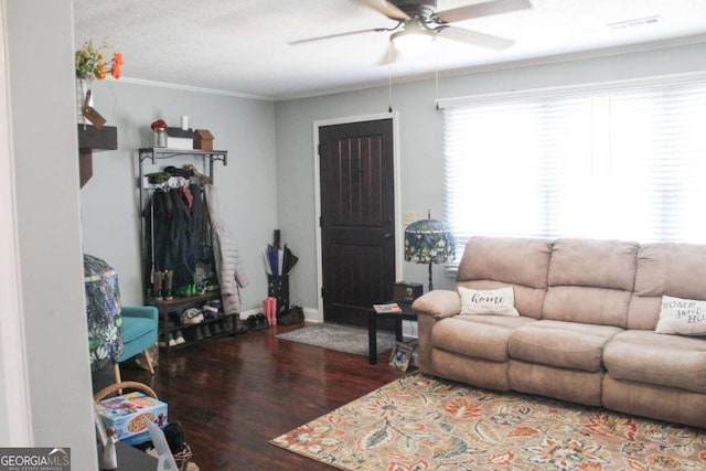 living room featuring ceiling fan, a textured ceiling, hardwood / wood-style flooring, and crown molding