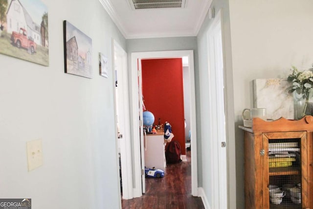 hallway with dark hardwood / wood-style flooring and ornamental molding