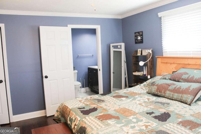 bedroom with ensuite bath, dark wood-type flooring, and crown molding