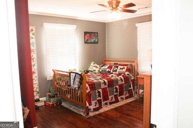 bedroom featuring ceiling fan, dark wood-type flooring, and crown molding