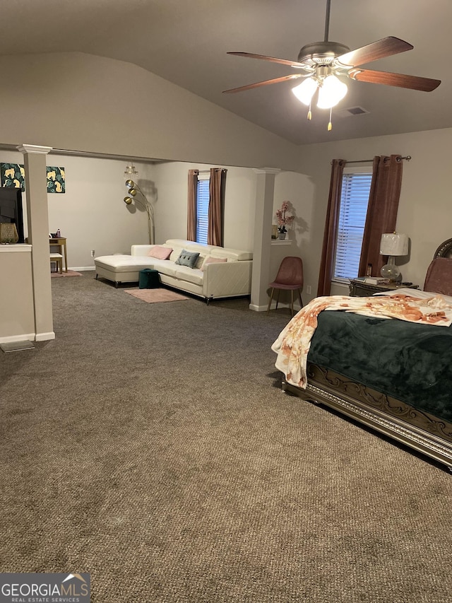 bedroom featuring dark colored carpet, vaulted ceiling, and ceiling fan