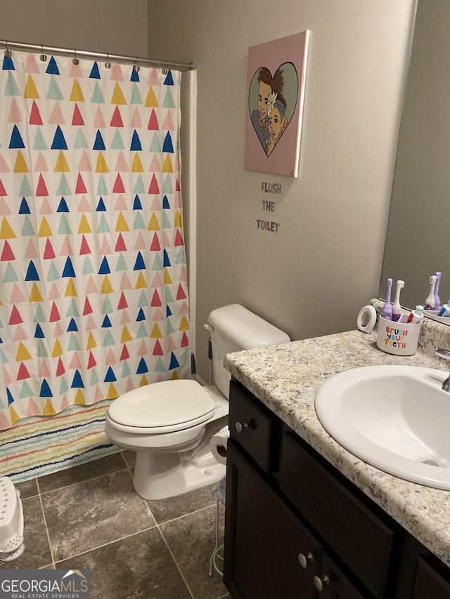 bathroom with vanity and toilet