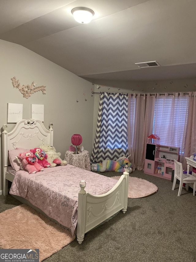 carpeted bedroom with lofted ceiling