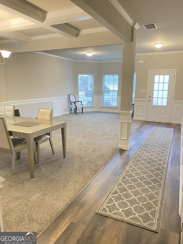 interior space featuring beamed ceiling, dark hardwood / wood-style floors, coffered ceiling, and crown molding