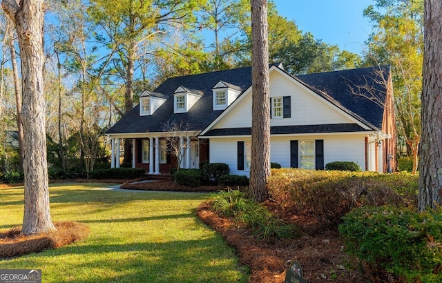 new england style home with a front yard