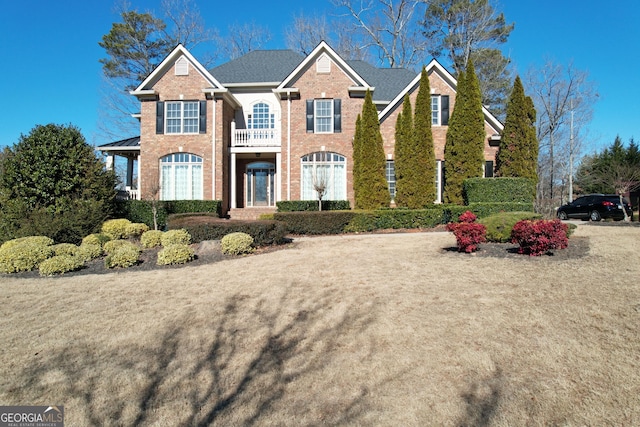 view of front of house with a balcony