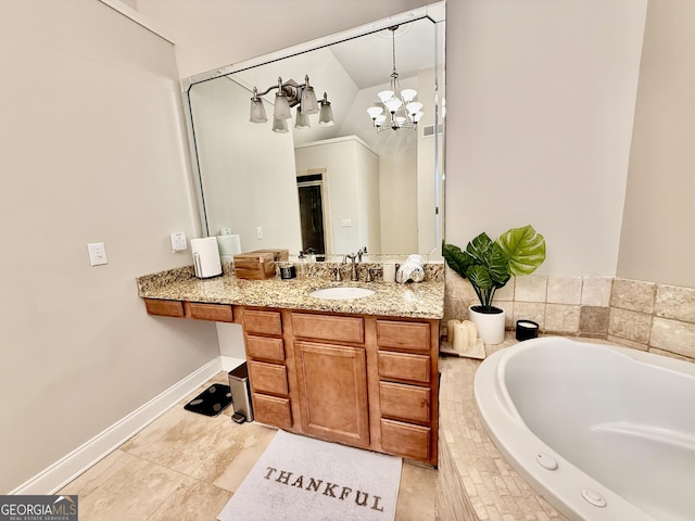 bathroom with tiled bath, vanity, tile patterned floors, and an inviting chandelier