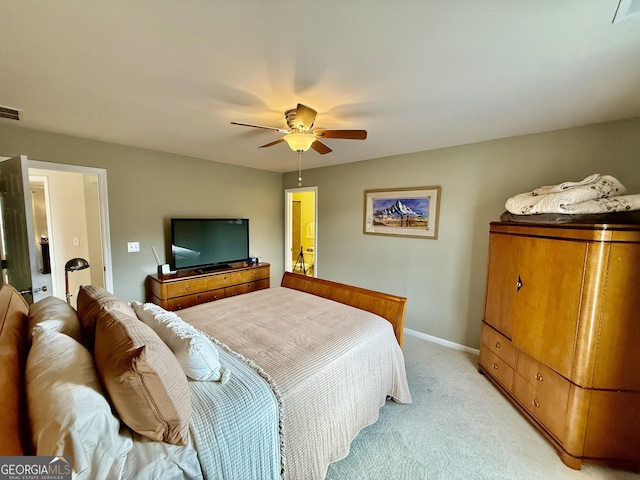 bedroom with ceiling fan and light colored carpet