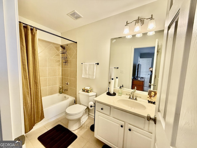 full bathroom featuring toilet, tile patterned floors, vanity, and shower / bathtub combination with curtain