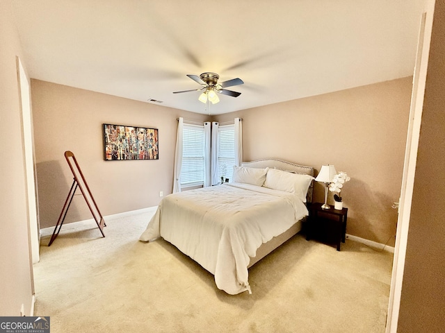 bedroom featuring ceiling fan and carpet