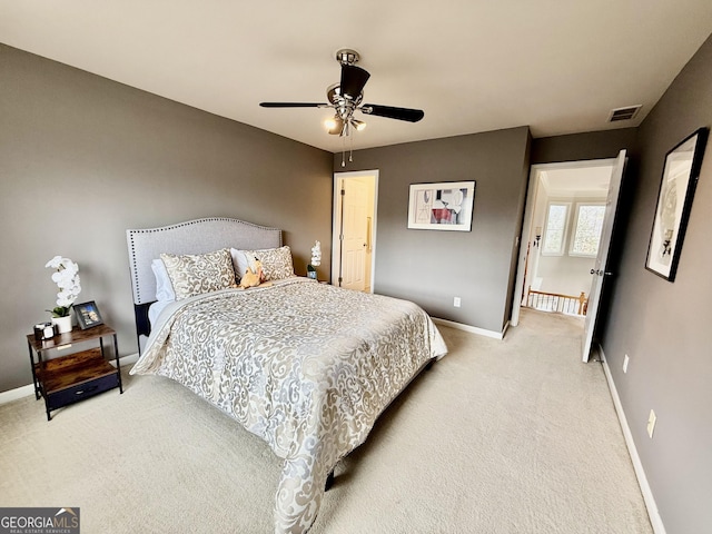 carpeted bedroom featuring ceiling fan