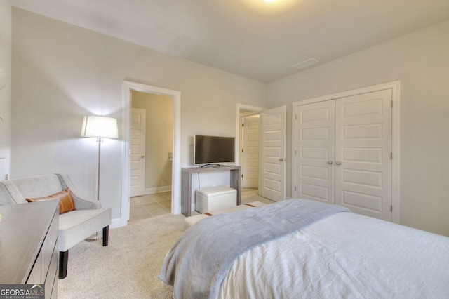 carpeted bedroom with a closet