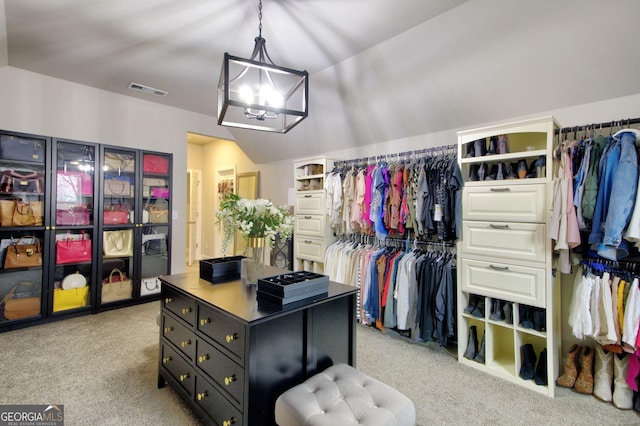 walk in closet featuring light carpet