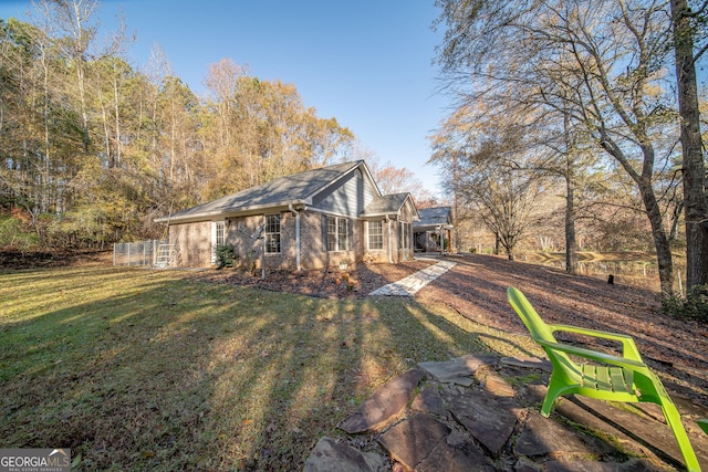 view of property exterior with a lawn