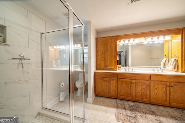 bathroom featuring vanity, toilet, and walk in shower