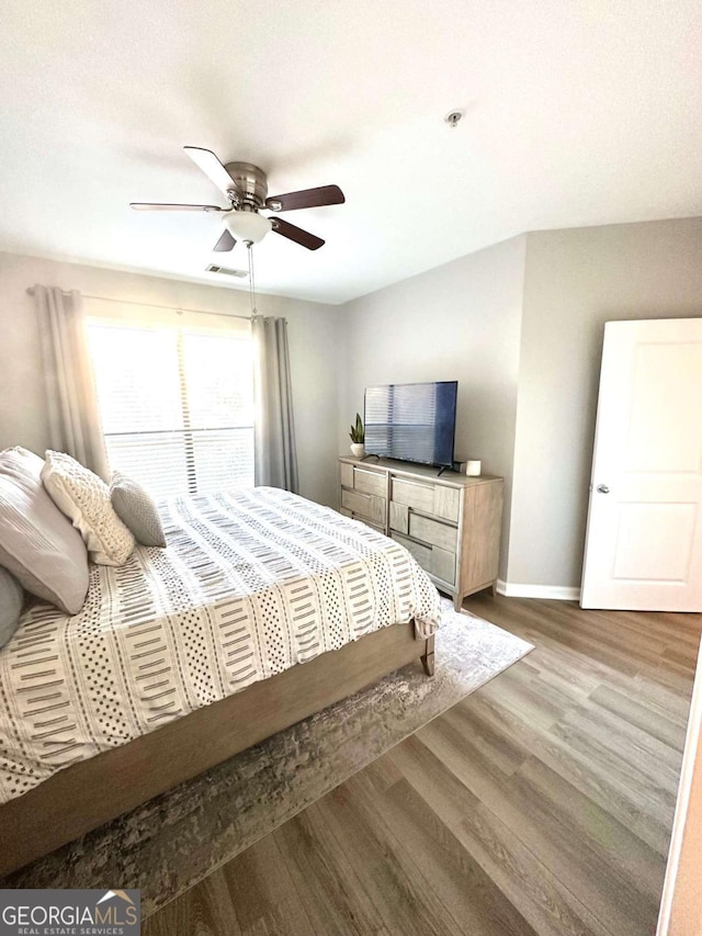 bedroom featuring ceiling fan and light wood-type flooring