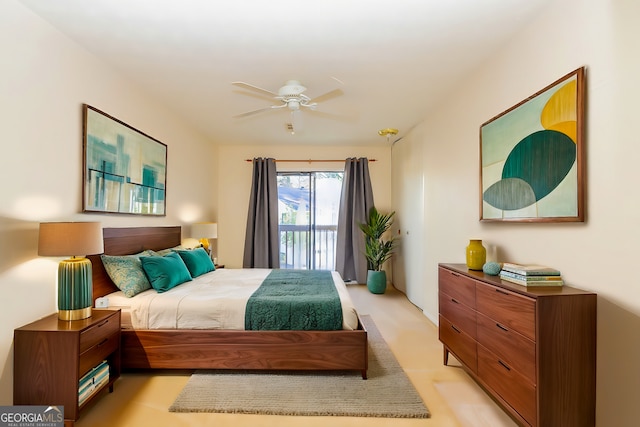 bedroom featuring ceiling fan and access to outside